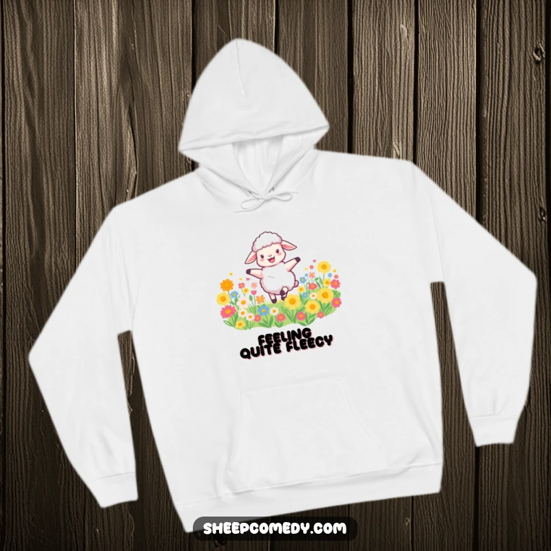 Funny Sheep Hoodie shows a happy sheep dancing in a colorful flower field, combining warmth with joyful and humorous farm animal art.