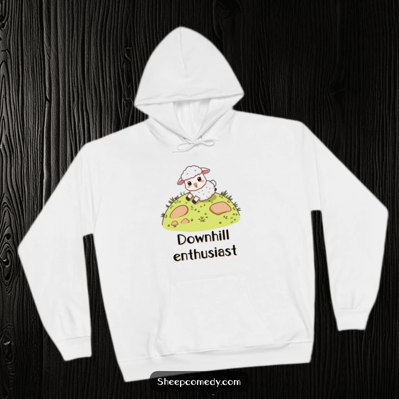 Funny hoodie depicting a giddy sheep character sliding down a whimsical, grassy hill, ideal for cozying up with a feeling of pure happiness.