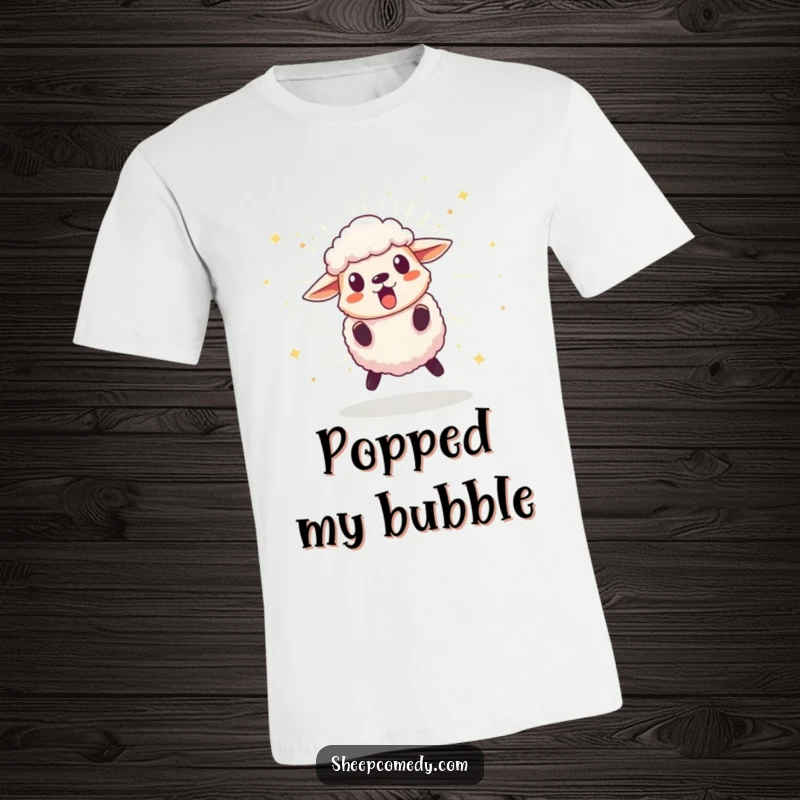 Funny t-shirt featuring a sheep character leaping back in surprise from an exploding, sparkling pom-pom, highlighting comical astonishment.
